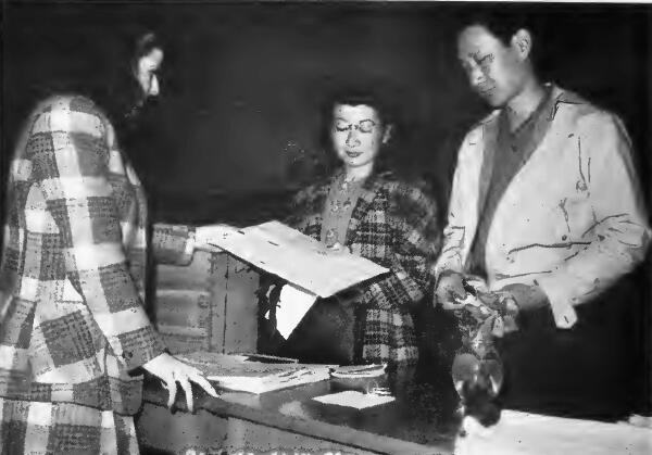 Young Japanese couple receive their registration record