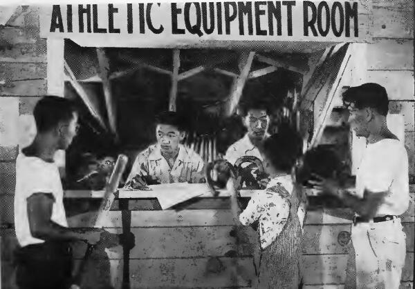 Evacuees signing for baseball equipment, horseshoes and volley balls at Portland (Oregon) Assembly Center