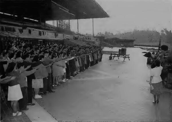 Graduating students pledging allegiance to The Flag