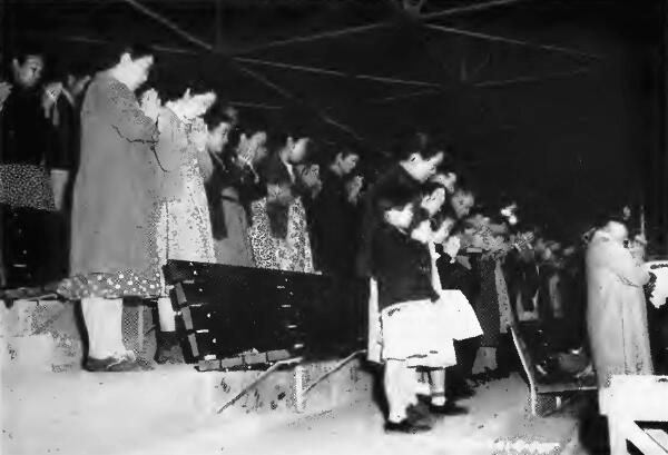 A Buddhist congregation praying at Santa Anita (California) Assembly Center