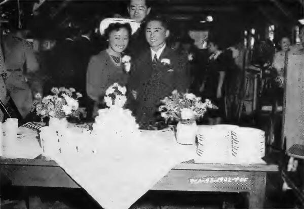 A happy young couple immediately after the ceremony at Santa Anita (California) Assembly Center