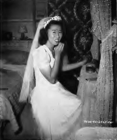 A bride in her boudoir just before a wedding in an Assembly Center